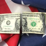 USA FATCA tax law - dollars and USA flag