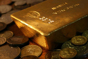 “Bullion bar with Coins” by Bullion Vault is licensed under CC BY-ND 2.0